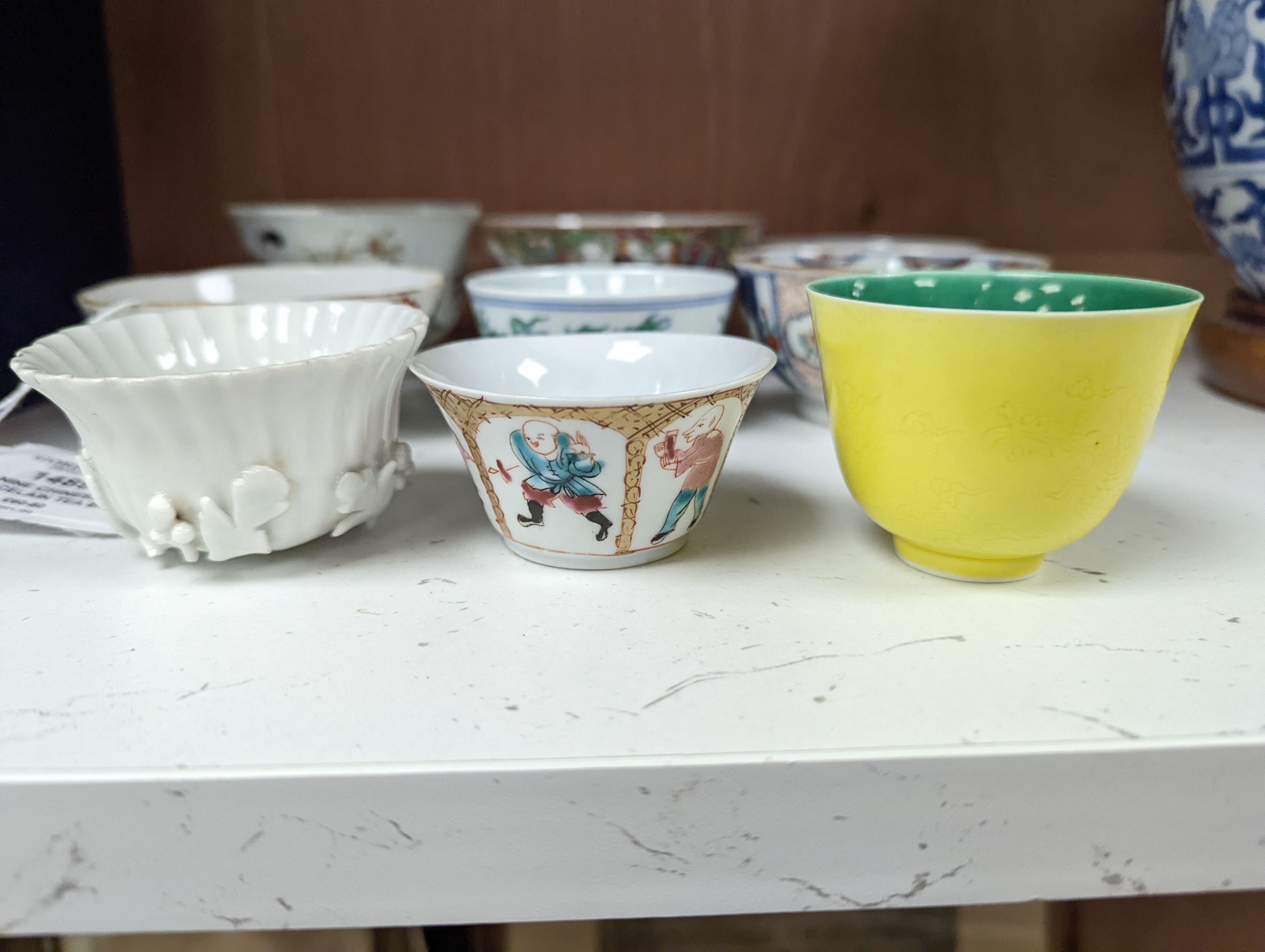 Nine Chinese porcelain tea bowls, tallest 6 cm.